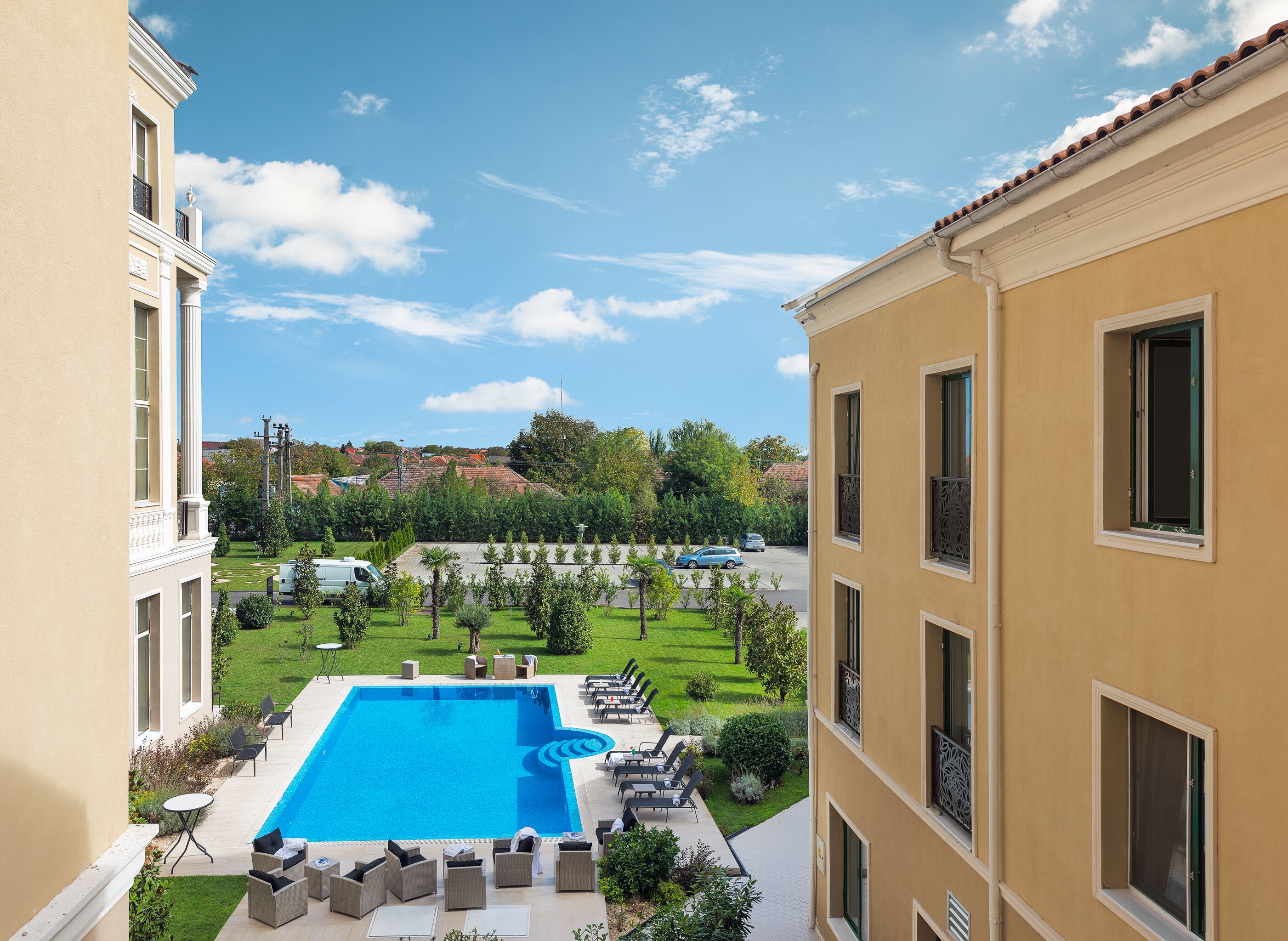 outdoor pool, open 6:00 am to midnight, pool umbrellas, pool loungers