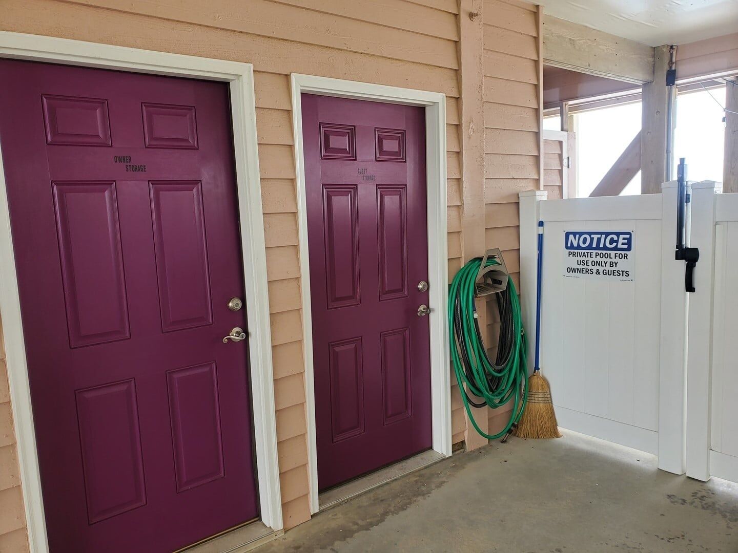 Two purple doors labeled 'Owner Storage' and 'Guest Storage' with a notice sign for a private pool.