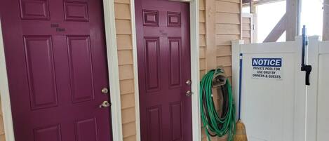 Two purple doors labeled 'Owner Storage' and 'Guest Storage' with a notice sign for a private pool.