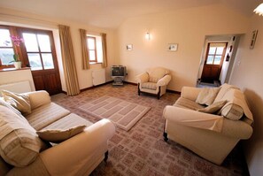 Habitación | Sala de estar | Una televisión, un reproductor de DVD