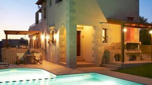 A two-story house with a swimming pool in the foreground. - Villa Patriko Lux villa with pool next to Balos (Kissamos)