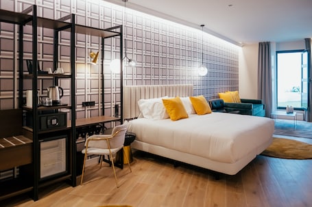 Junior Studio Suite | Down comforters, memory foam beds, minibar, in-room safe