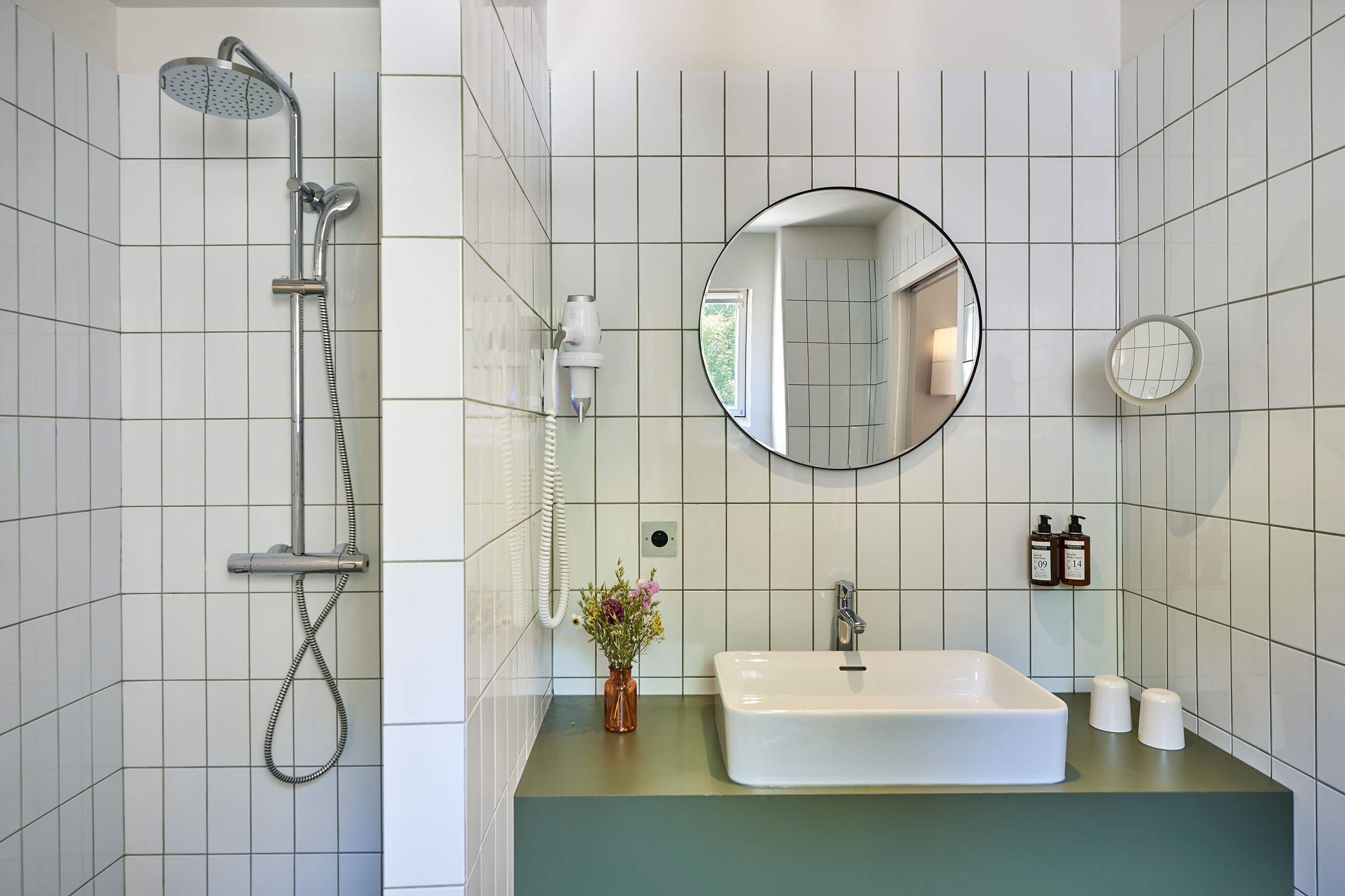 deluxe suite | bathroom | shower, free toiletries, hair dryer, bathrobes