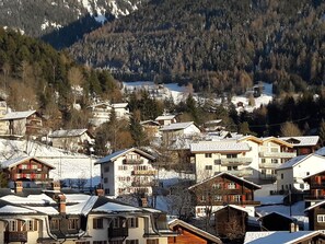 Houses blend into the mountain landscape on terraced slopes.