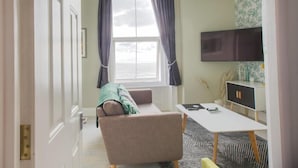 Apartamento | Zona de estar | Una televisión de pantalla plana