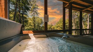 A hot tub with a wooden deck and a sign warning of hot tub safety. - Amazing mountain view cabin, Hot tub, wifi near Mercier Orchards! (Blue Ridge)