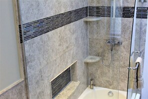 Combined shower/tub, hair dryer, towels, soap