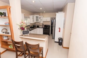 House | Private kitchen | Fridge, microwave, stovetop, coffee/tea maker - Stacys Place St James Ground Floor 2 Bedroom (Port of Spain)