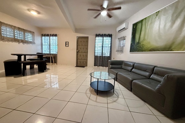 Roomy with living room, dining and work station areas.