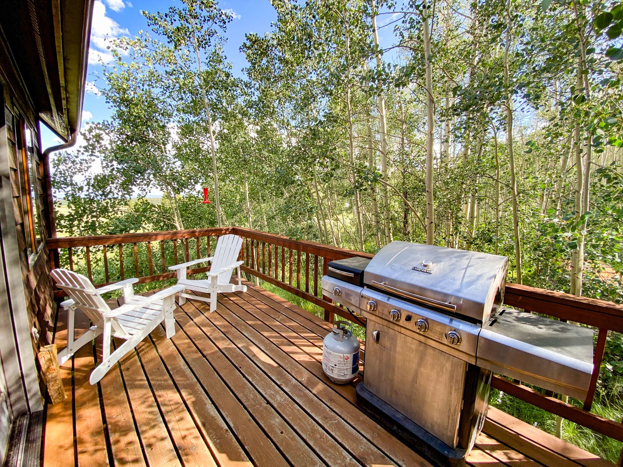There is a grill and some outdoor furniture to enjoy your private escape.