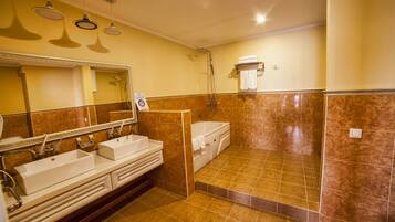 Luxury Suite | Bathroom | Rainfall showerhead, hair dryer, bathrobes, slippers