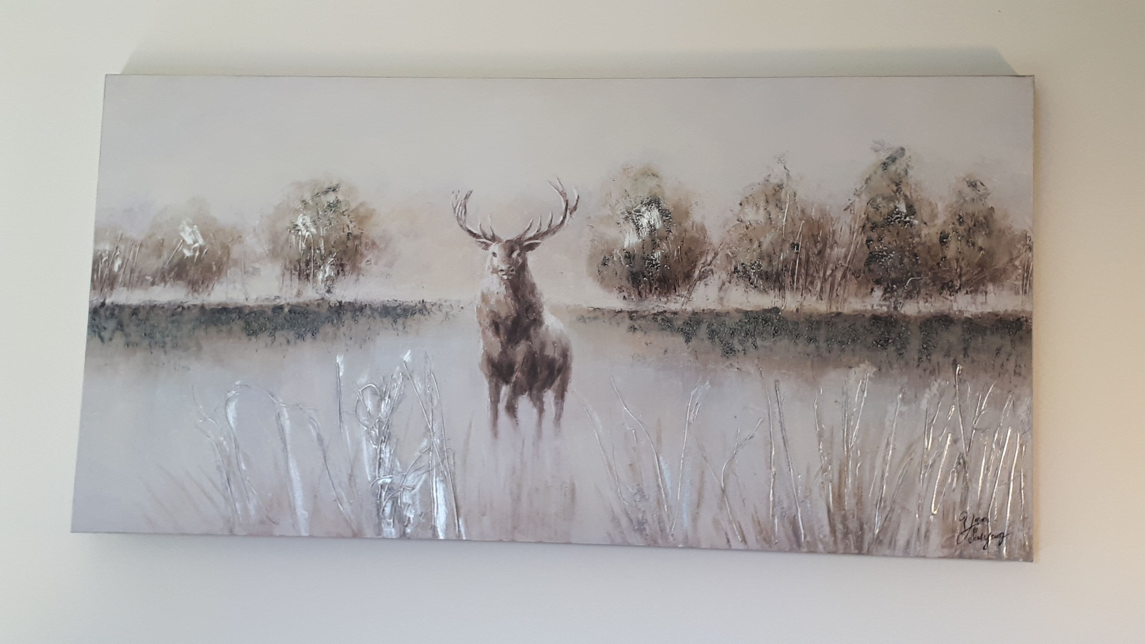 A painting of a deer by a body of water with trees in the background.