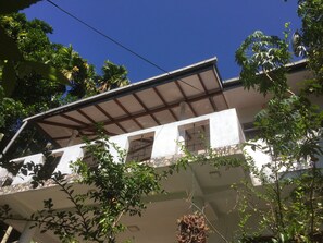 Guests can enjoy a balcony with lush views of the surrounding greenery.