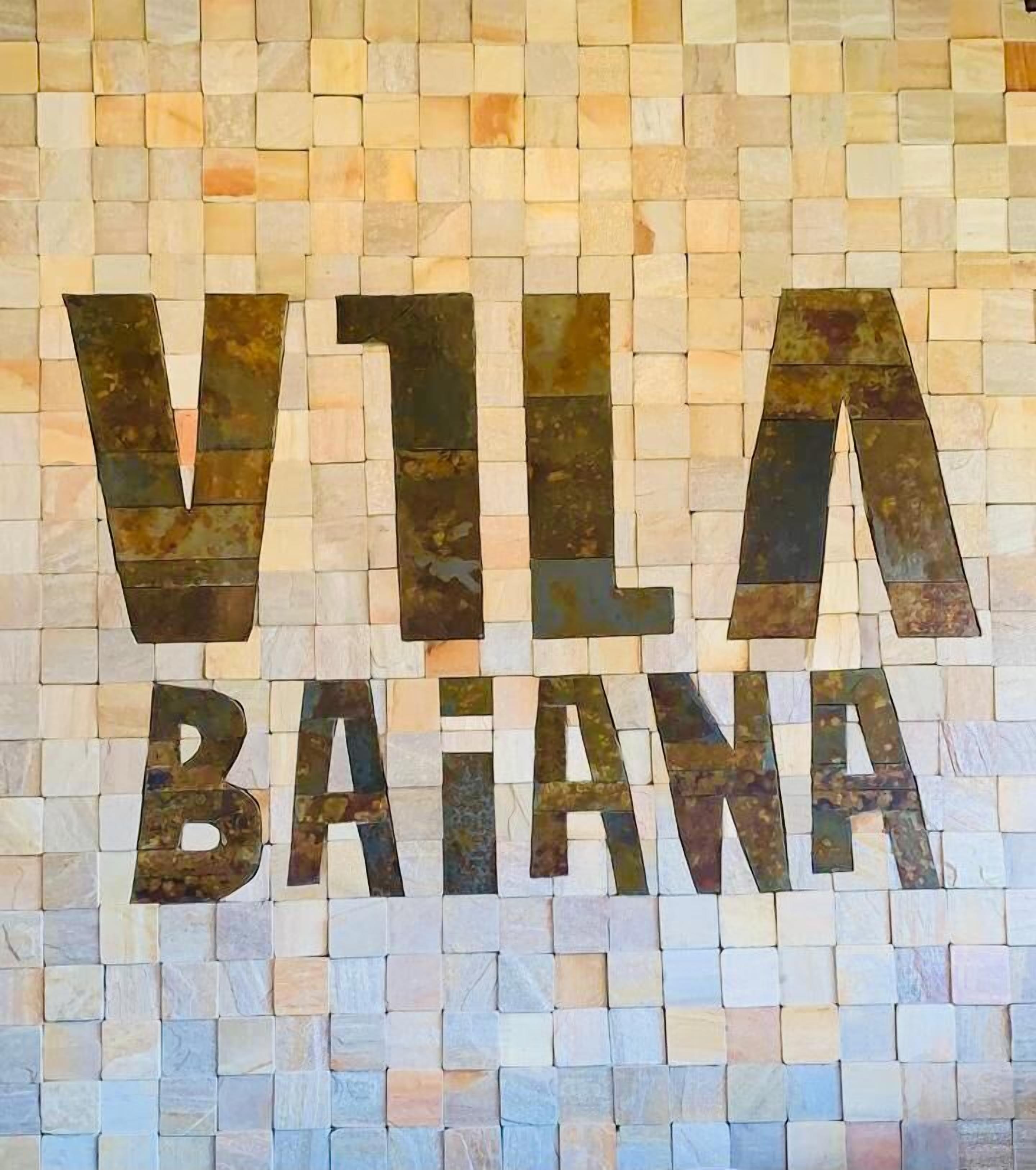 A mosaic wall with the text "VILLA BATANA".