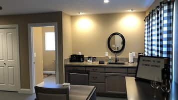 Fridge, microwave, coffee/tea maker, cookware/dishes/utensils