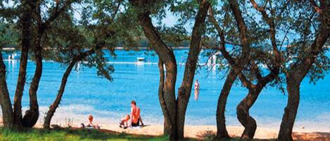 Beach nearby, white sand, sun loungers, beach umbrellas