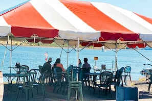 Enjoy meals with a view of the sea from this casual outdoor dining area.