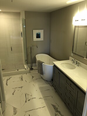 Combined shower/tub, hair dryer, towels, soap