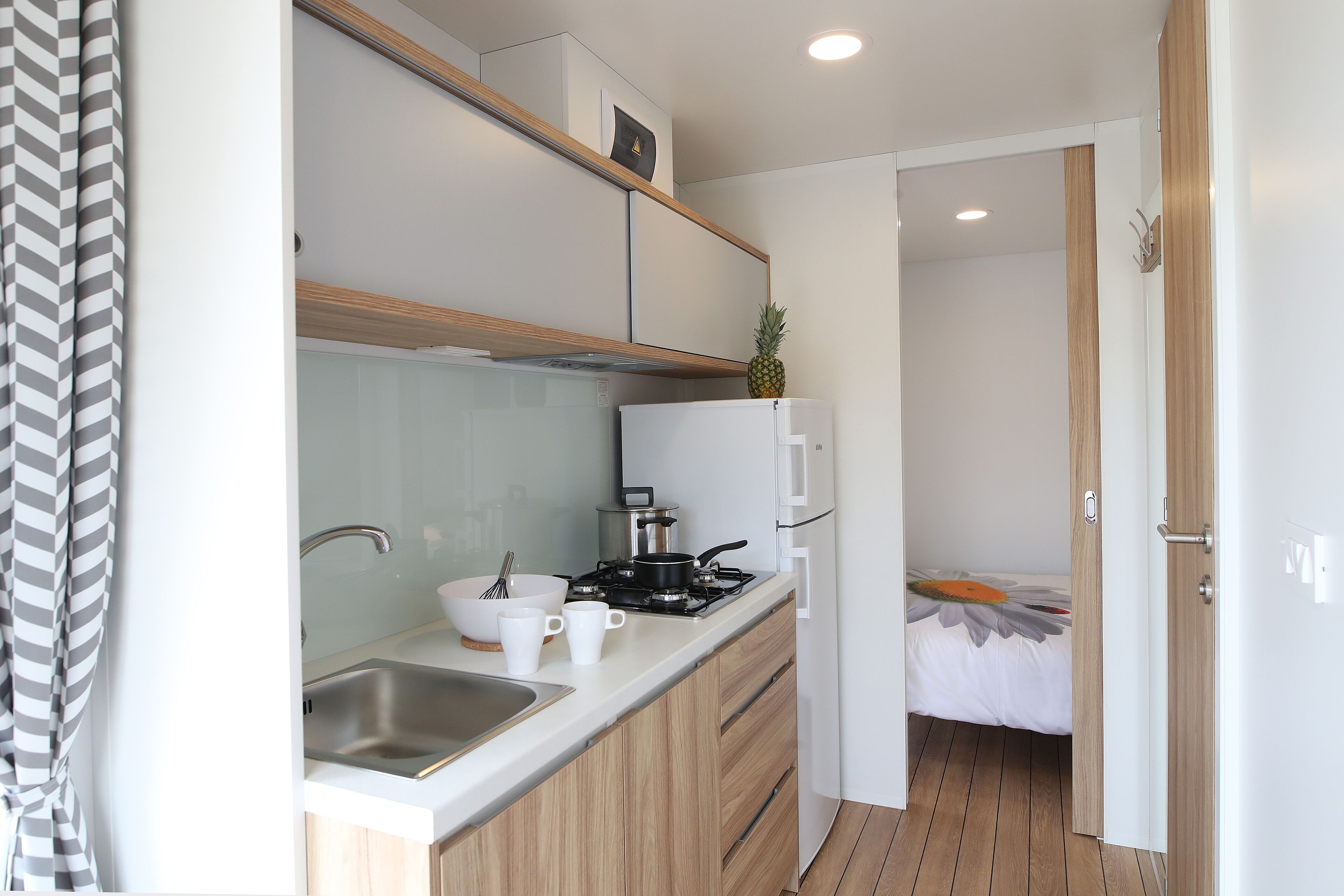 Mini-fridge, microwave, stovetop, cookware/dishes/utensils