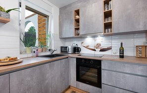 Fridge, stovetop, dishwasher, coffee/tea maker