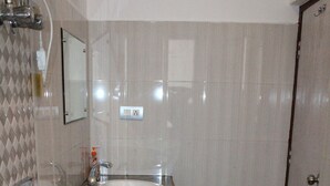 Standard Double Room | Bathroom | Shower, rainfall showerhead, free toiletries, towels - The Coral inn (Gangtok)