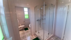 Shower, towels, soap, toilet paper