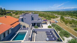A modern villa with a rooftop pool, outdoor seating, and a scenic view of the countryside. - Pet friendly home in Zagrad (Zagrad)
