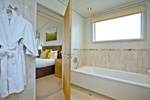 Bathtub, hair dryer, towels