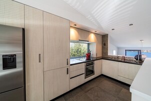 Private Deluxe Apartment | Private kitchen | Full-size fridge, microwave, oven, stovetop