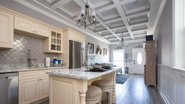 A kitchen with a central island, built-in appliances, and a chandelier. - Mid City Mansion, Southern Living Walk to streetcar (New Orleans)