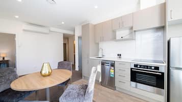 Private 2 Bedroom Executive Apartment | Private kitchen | Full-sized fridge, microwave, oven, stovetop