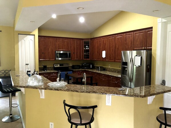 Coffee/tea maker, fridge, microwave, oven