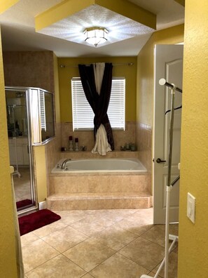 Bathtub, jetted tub, hair dryer, towels