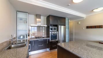 Private 2 Bedroom Deluxe Apartment | Private kitchen | Full-sized fridge, microwave, oven, stovetop