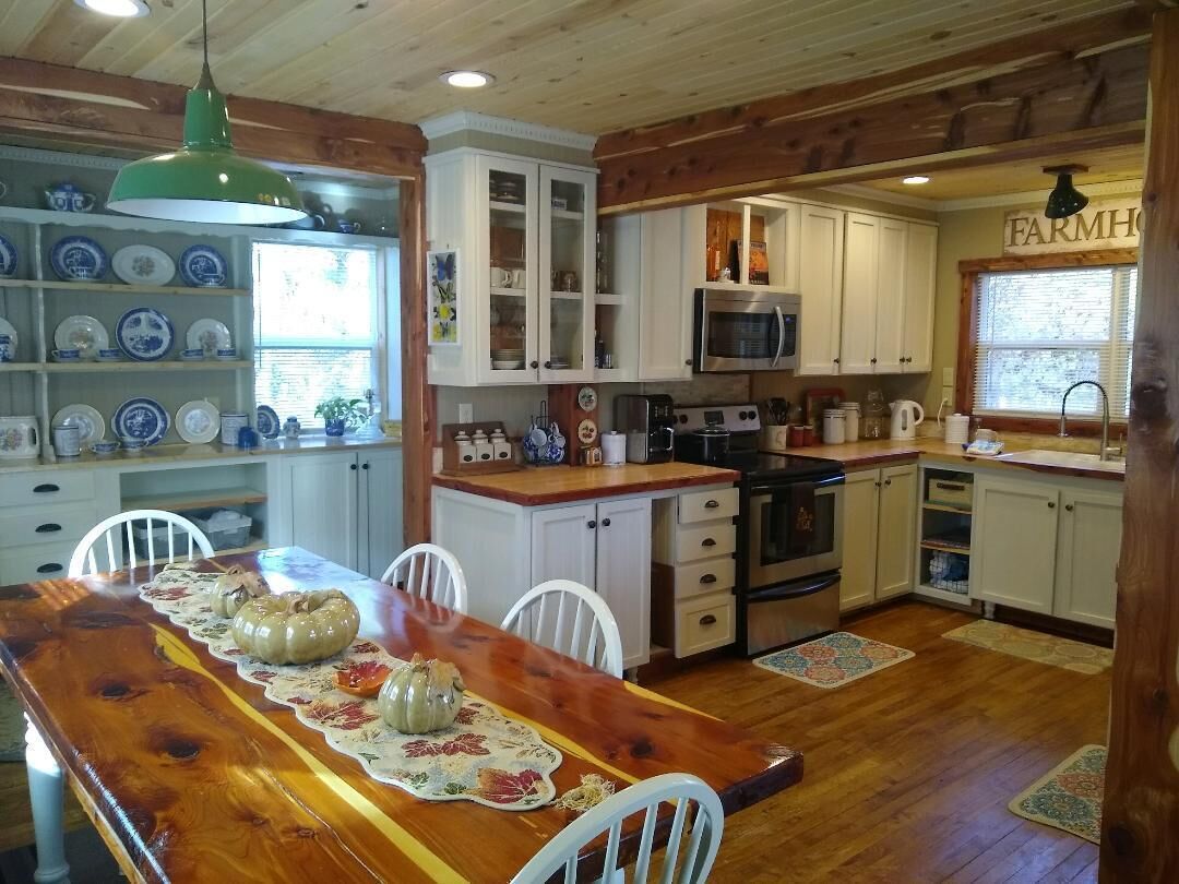 stovetop, indoor, oven, microwave, indoor dining, dining table, kitchen visible