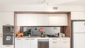 City Apartment, 1 Bedroom | Private kitchen | Full-size fridge, microwave, oven, stovetop - Soda Apartment (South Brisbane)