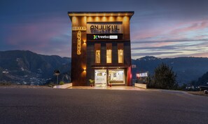 A modern hotel with a prominent sign reading "ANJUKUL HOTEL" and "treebo ANJUKUL" on the facade. - Treebo Anjukul (Dalhousie)