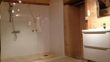 Shower, rainfall showerhead, hair dryer, towels