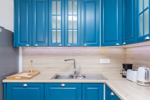 Vila, 3 quartos | Cozinha privada | Geladeira grande, fogão, cooktop, lava-louças