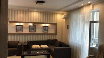 Apartment, 1 Bedroom | Living area | Flat-screen TV