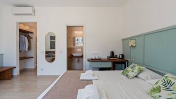 1 bedroom, desk, iron/ironing board, travel crib