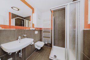 Shower, towels, toilet paper