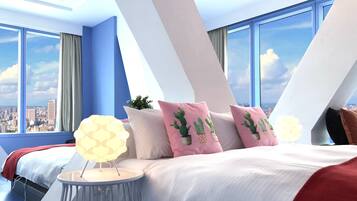 Deluxe Quadruple Room, City View | Down comforters, individually decorated, free WiFi