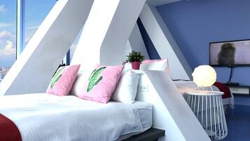 Deluxe Quadruple Room, City View | Down comforters, individually decorated, free WiFi