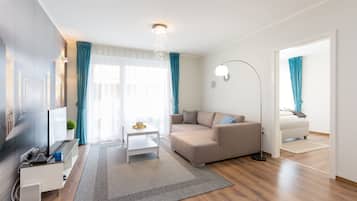 Luxury Apartment, 2 Bedrooms | Living room | 102-cm LED TV with cable channels, TV, Netflix