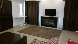 Luksussuite | Oppholdsrom | Peis