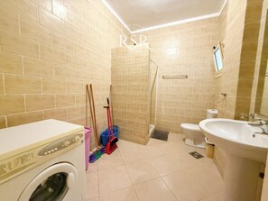 Bathtub, hair dryer, towels, soap