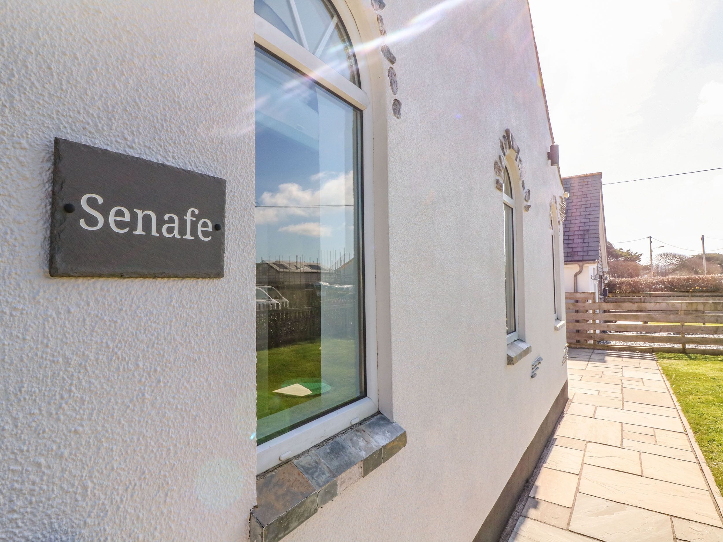 A building with a sign reading "Senafe."
