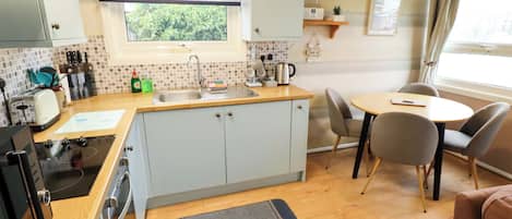 Fridge, microwave, electric kettle, cookware/dishes/utensils