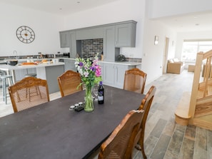 Enjoy cooking and dining in this well-equipped kitchen with a stove and ample counter space.